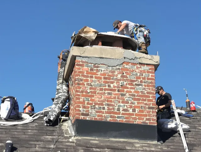 Watertown Chimney Sweep installing a custom chimney crown in Watertown, CT