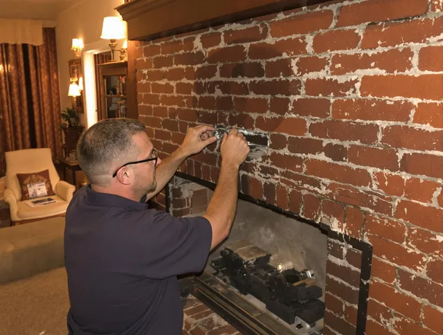 Watertown Chimney Sweep expert fixing a fireplace in Watertown, CT